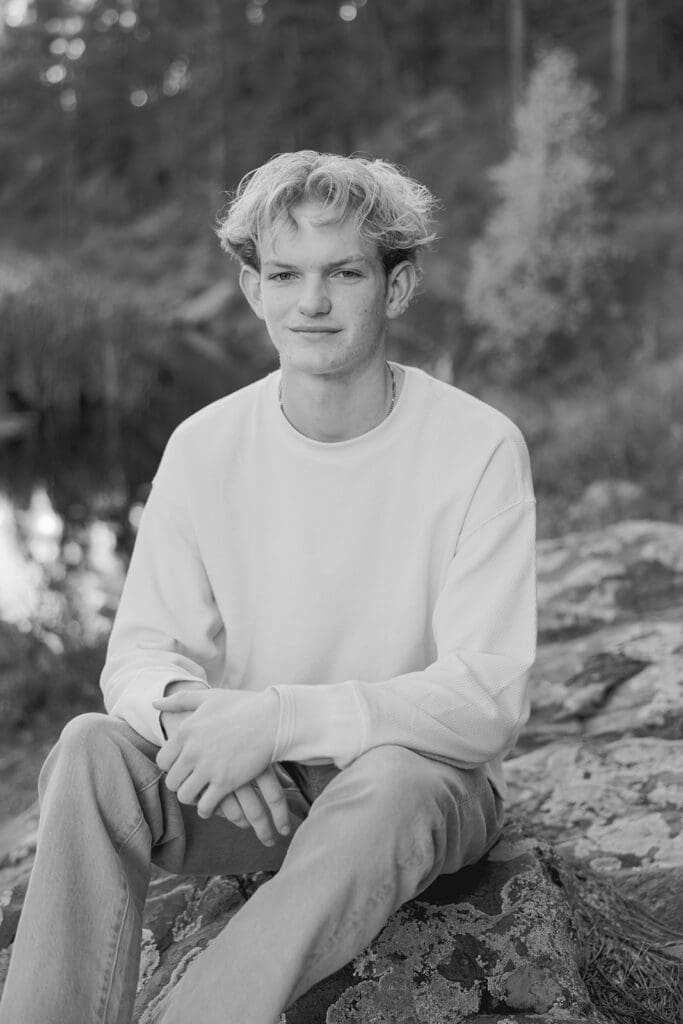 Rapid City Senior Photographer, boy in black and white  on rock